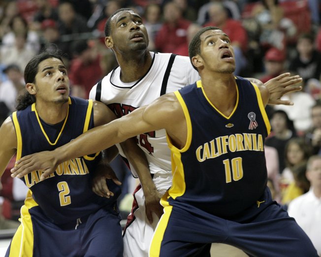 Darris Santee of UNLV gets boxed out by Jorge Gutierrez (left) and Jamal Boykin of California Friday at the Thomas & Mack Center.
