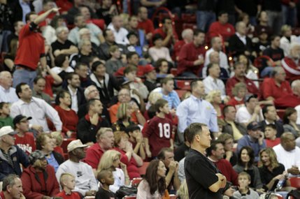 UNLV fans boo a call as Rebels head coach Lon Kruger looks on.  California defeated the Rebels 73-55 Friday at the Thomas & Mack Center.