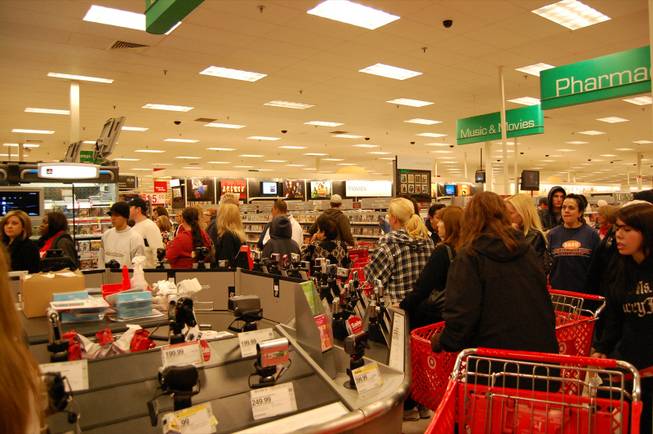 Customers wait in line  for popular items at Target's electronics department Friday morning just after 6 a.m. 