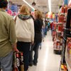 Shoppers stand in line waiting to check out at Toys "R" Us just before 1 a.m., about an hour after the store opened its doors for Black Friday. 