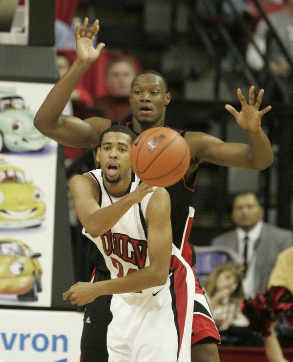 UNLV guard Rene Rougeau passes out of the lane against ...