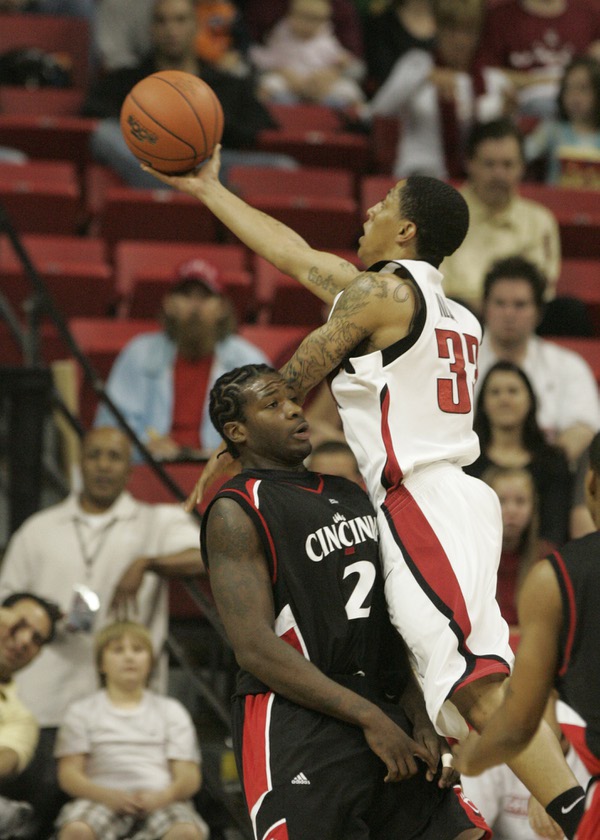 UNLV guard Tre'Von Willis shoots over the top of Cincinnati ...