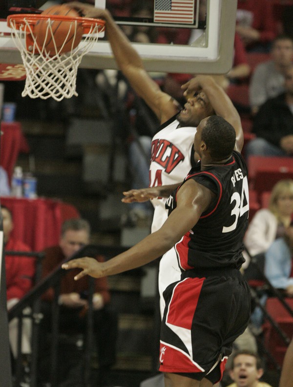 UNLV forward Darris Santee dunks on Cincinnati forward Yancy Gates ...
