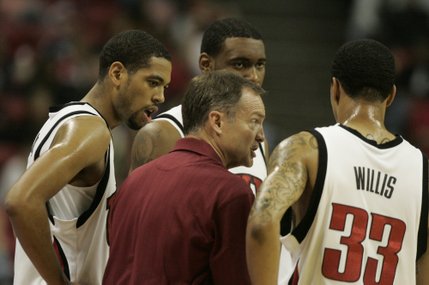 UNLV coach Lon Kruger talks with, from left, Rene Rougeau, Darris Santee and Tre'Von Willis during a break in the first half of their game against Cincinnati at the Thomas & Mack Center.