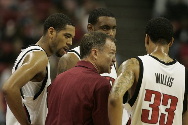 UNLV coach Lon Kruger talks with, from left, Rene Rougeau, ...