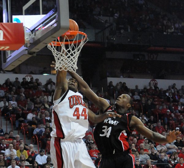 UNLV's Darris Santee dunks on Yancy Gates of Cincinnati Saturday ...