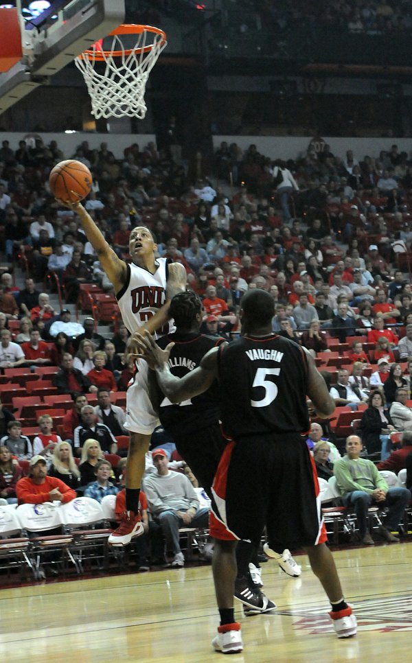 Tre'Von Willis of UNLV lays it up over Mike Williams ...