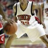 Tre'Von Willis of UNLV plays tight defense as Cincinnati brings the ball upcourt Saturday at the Thomas & Mack Center.