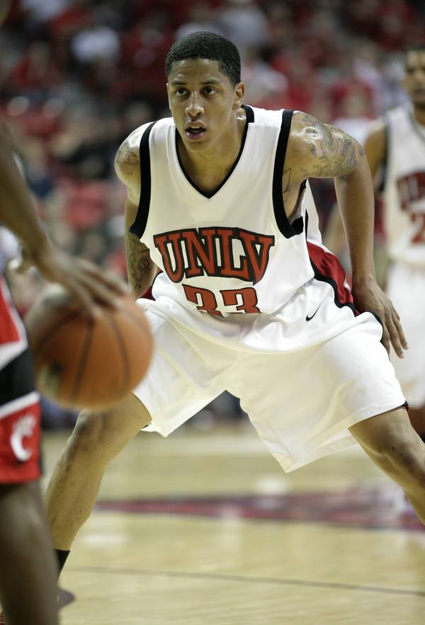 Tre'Von Willis of UNLV plays tight defense as Cincinnati brings ...