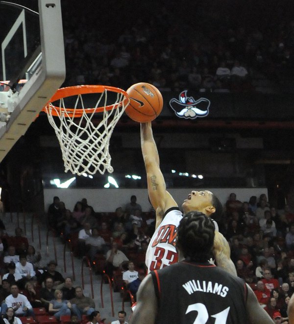 Tre'Von Willis of UNLV throws down a one-handed jam as ...