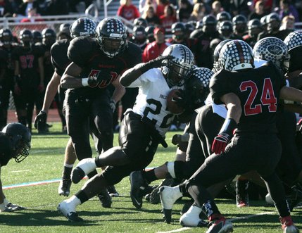 Palo Verde running back Chaz Thomas (22) pounds his way through the line for a few extra yards Saturday.