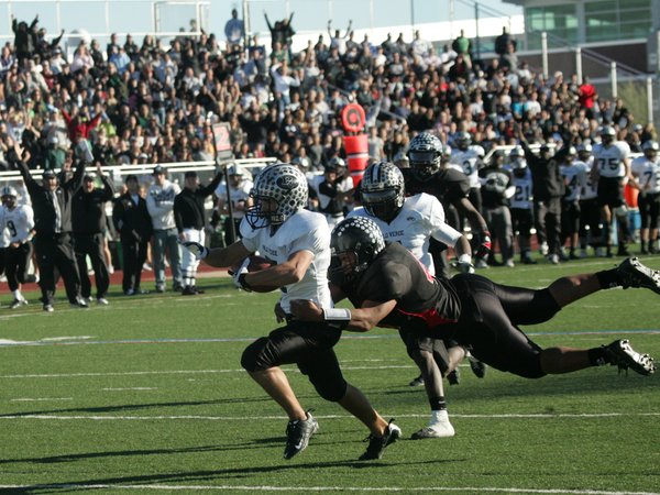 Palo Verde's Grant Bernhardy (7) carries a Vegas defender after ...