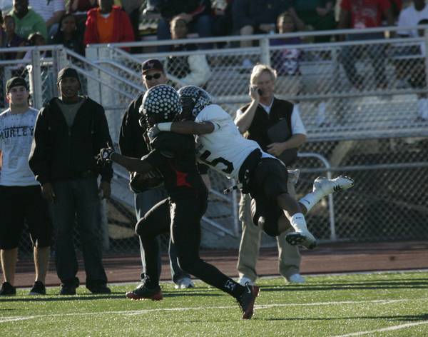 Palo Verde's Torin Harris (5), right, tackles Las Vegas wide ...