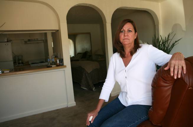 Jennette Nelson, one of many victims of the stagnant local economy, moved into this $200-a-week residence motel near the Strip after losing her job as a restaurant server. "In retrospect, I wish I saved that money," she says. 