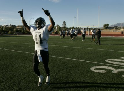 Palo Verde's Tyrone Blake walks off the field in celebration after defeating Las Vegas 42-21 on Saturday.