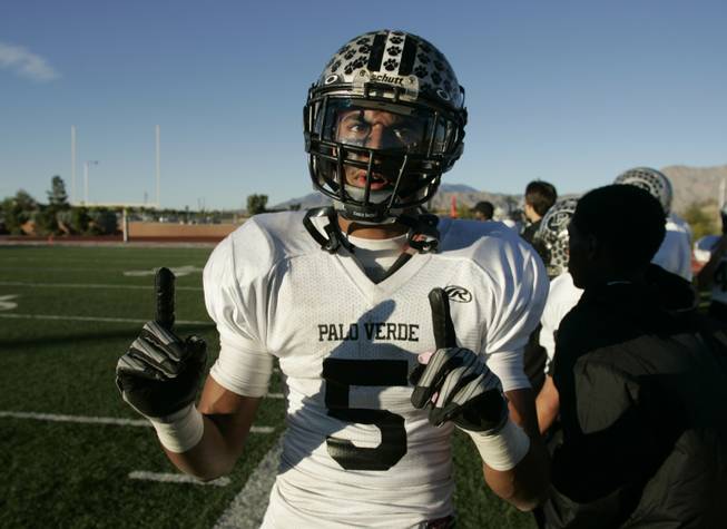 Palo Verde's Torin Harris signals the team's standing in the valley after defeating Las Vegas 42-21 Saturday.
