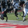 Las Vegas; Reggie Bullock (5) hurdles in for a touchdown during the Nevada State semifinals football