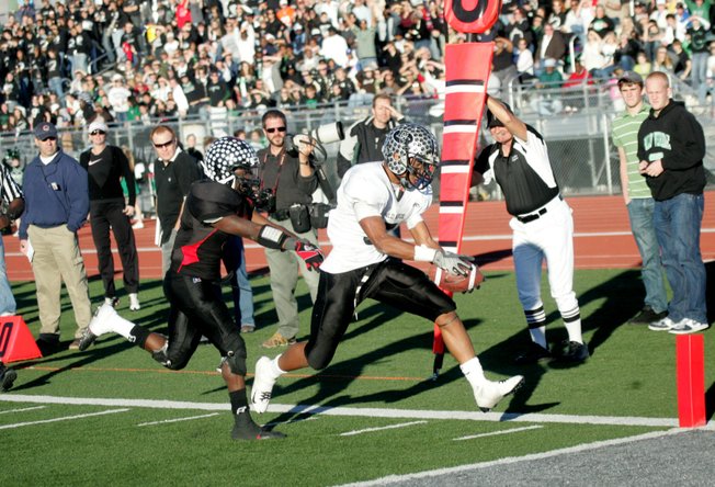 Palo Verde running back Torin Harris (5) dives for one of his four touchdowns Saturday as the Panthers trounced Las Vegas High 42-21 in the Nevada State semifinals.
