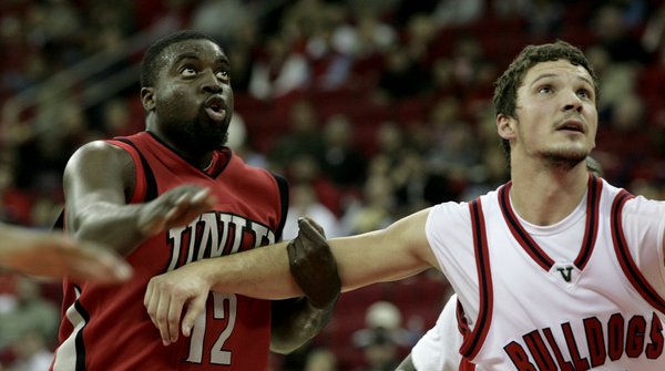 Brice Massamba of UNLV and Nedeljko Golubovic fight for position ...