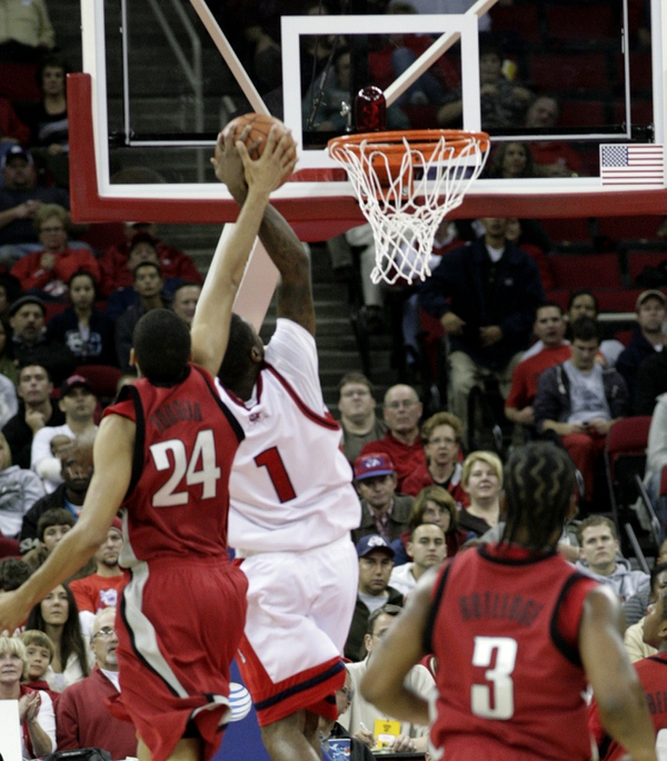 Rene Rougeau of UNLV blocks Mychal Ladd Wednesday night as ...