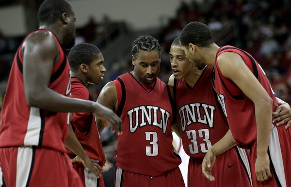 The Rebels gather during a break in the action Wednesday ...