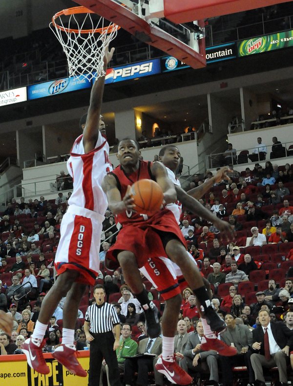 UNLV's Wink Adams goes up for the reverse layup Wednesday ...