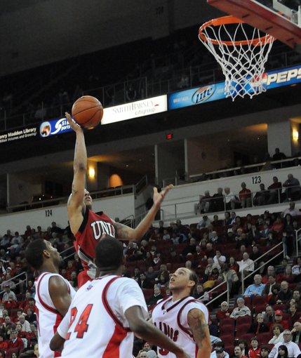 Tre'von Willis of UNLV rises above the defense Wednesday night as the Rebels take on the Fresno State Bulldogs at the Save Mart Center in Fresno, Calif.