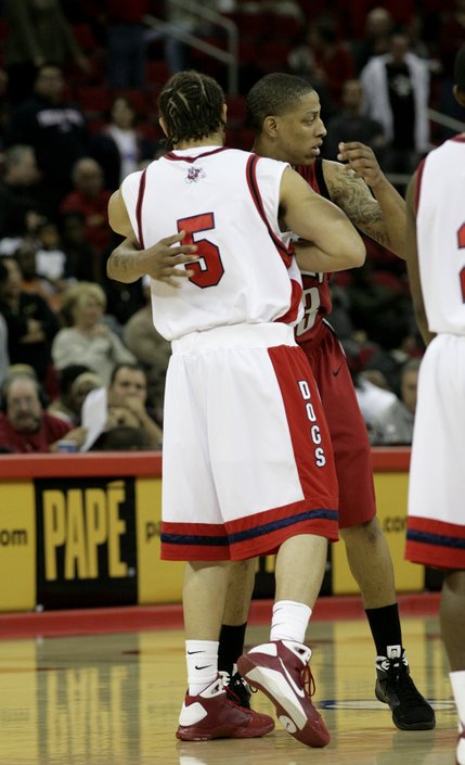 Tre'von Willis of UNLV and Dwight O'Neil Embrace before the game Wednesday night as the Rebels take on the Fresno State Bulldogs at the Save Mart Center in Fresno, Calif.  Willis and O'Neil are half-brothers.  