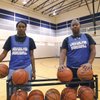 Lady Wolves Marquichea Burns, left, and Michaela Thomas pose for a photo after practice.
