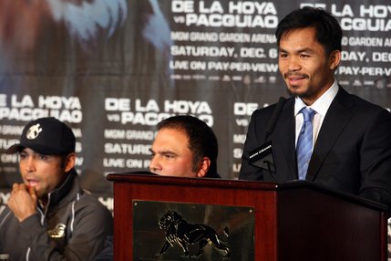 Boxer Manny Pacquiao, (right) of the Philippines, speaks during a news conference at the MGM Grand on Wednesday, December 3, 2008. Pacquiao and De La Hoya, far left, will meet for a 12-round welterweight fight at the MGM Grand Garden Arena on Saturday. Golden Boy CEO Richard Schaefer listens at center.
