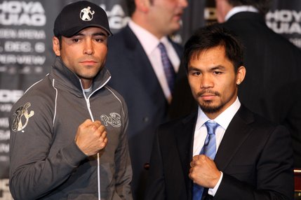 Boxers Oscar De La Hoya, left, and Manny Pacquiao pose during a news conference at the MGM Grand Wednesday, December 3, 2008. De La Hoya and Pacquiao will meet for a 12-round welterweight fight at the MGM Grand Garden Arena on Saturday.
