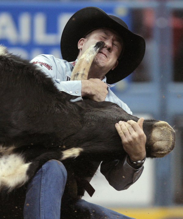 Les Shepperson, of Midwest, Wyo., competes during the first go-round ...