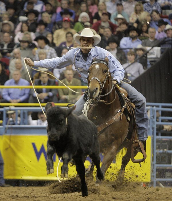 Stran Smith, of Childress, Texas, competes during the first go-round ...