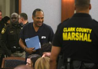 O.J. Simpson appears during a sentencing hearing at the Clark County Regional Justice Center in Las Vegas on Dec. 5, 2008.
