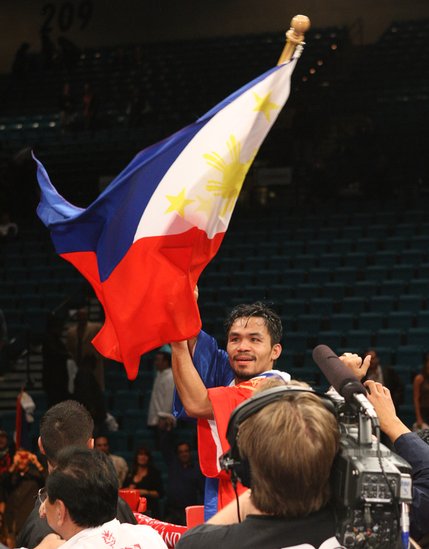 Manny Pacquiao of the Philippines celebrates his victory over Oscar De La Hoya of the U.S after their welterweight fight at the MGM Grand Garden Arena Saturday night.
