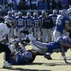 McQueen senior Anthony Martinez dives dives for positive yards Saturday at Mackay Stadium in Reno. M