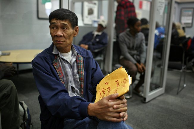 Nguyen Men waits for the phones set aside for unemployment insurance calls at Nevada JobConnect in Las Vegas.
