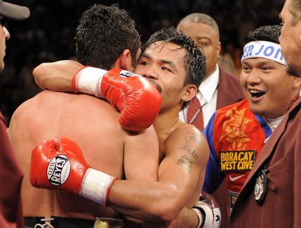 Oscar De La Hoya, left, hugs Manny Pacquiao after their welterweight boxing match in Las Vegas on Saturday, Dec. 6, 2008. Pacquiao won the fight with an eighth round TKO.