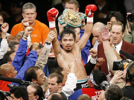 WBC lightweight champion Manny Pacquiao celebrates his victory over Oscar De La Hoya shortly after their welterweight boxing match in Las Vegas on Saturday, Dec. 6, 2008. Pacquiao won by TKO after the end of the eighth round.