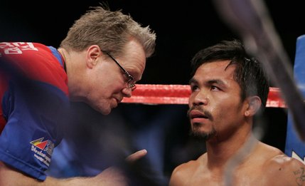 Boxing trainer Freddie Roach talks to Manny Pacquiao between rounds during a welterweight fight aginst Oscar De La Hoya at the MGM Grand Garden Arena in Las Vegas on Saturday, December 6, 2008.