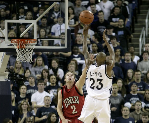 Armon Johnson of UNR shoots it over the top of ...