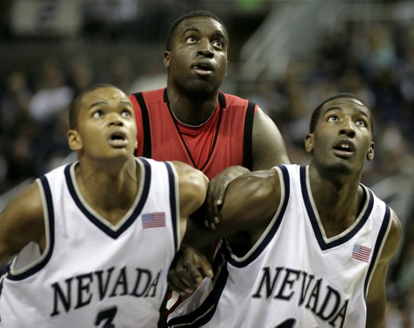 Brice Massamba of UNLV gets boxed out by Joey Shaw ...