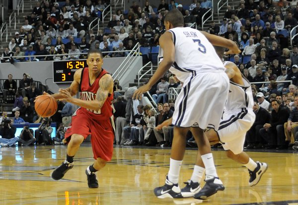 Tre'von Willis of UNLV drives it in against the UNR ...