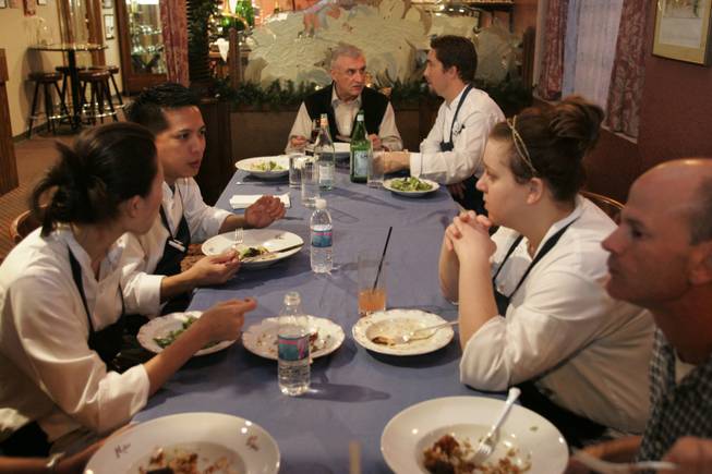 Chef Andre Rochat has dinner with the staff of his original restaurant last week before they begin work. The employees at the Sixth Street restaurant will be moved to Rochat's restaurant at the Monte Carlo. He also owns Alize at the top of the Palms.