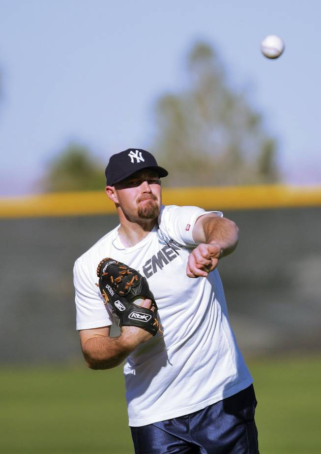 Former CSN baseball player, Mike Dunn, practices pitching at Lied Field on Dec. 3. Recently added to the Yankees 40-man roster, Dunn works on his off-season training with his former coach Tim Chambers.