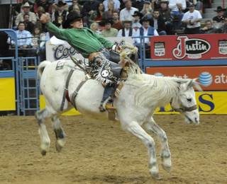 Scenes from Thursday night's action of the 50th anniversary of the National Finals Rodeo at the Thomas & Mack Center.
