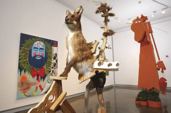 "S.O.S.," from left, is acrylic on canvas by Wendell Gladstone; "Half Knot," by Jared Pankin, uses wood, sawdust, synthetic fur and glass eyes; and "Country Boy" by Wayne White is mixed media.