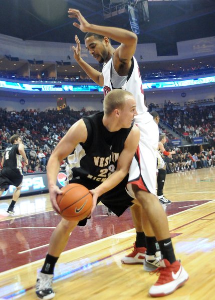 Rene Rougeau of UNLV towers over David Kool of Western Michigan at the Orleans Arena where UNLV took on Western Michigan Sunday afternoon.  UNLV beat Western Michigan 70-61.