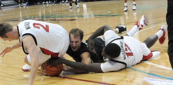 Kendall Wallace and Brice Massamba of UNLV fight for the ...