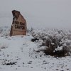 Snow covers the Red Rock Canyon sign Monday morning in Blue Diamond at the park entrance off Blue Diamond Road. 
